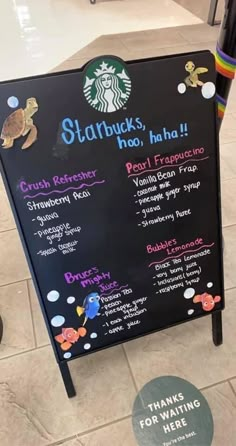 a starbucks menu board on the floor in a store