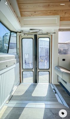 the inside of an rv with sliding glass doors