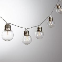 an assortment of light bulbs hanging from a string