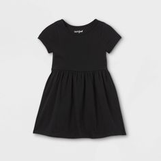 Update her everyday wardrobe with this Black Solid Knit Short-Sleeve Dress from Cat and Jack?. This short-sleeve dress made from soft and breathable knit fabric makes a comfortable everyday outfit. It features a simple round neck and a solid black color for a versatile look. This regular-fit dress gently flares at the waist and sports a pullover style for easy changing and dressing. Have her wear it with sandals or sneakers, then add a cardigan and tights during the cooler season. Size: 12M. Gen Photography Outfits, Dr Closet, Guest Attire, Family Pics, Knit Short, Memorial Service, Everyday Outfit, Fit Dress, Jack Black