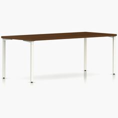 a rectangular table with white legs and a brown top