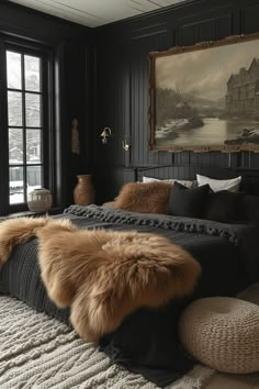 a bedroom with black walls and fur on the bed