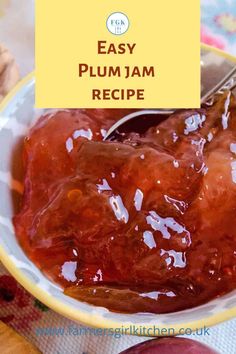 a bowl filled with plum jam on top of a table