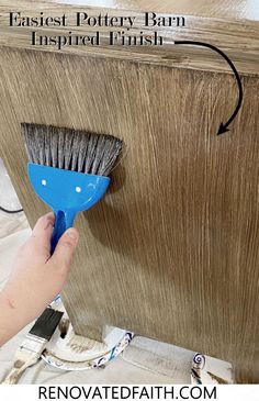 a person using a brush to clean the bottom of a wooden cabinet with text overlay