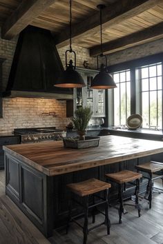 a large kitchen island with stools in front of it and an oven on the other side