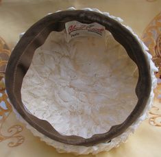 "This is a wonderful and unique hat! The label shows it is from \"filbert orcel BOUTIQUE, Paris\". This is woven ivory white colored plastic, with a straw appearance. The border is a light brown satin. This hat measures 8\" across. The height at the highest point is 3 & 3/4\". This is in excellent condition, I see no issues. Fantastic!" Vintage Cream Top Hat With Curved Brim, Vintage Beige Top Hat With Curved Brim, Vintage Beige Top Hat With Short Brim, Vintage White Cloche Fascinator, White Vintage Cloche Fascinator, Vintage Cream Mini Hats With Curved Brim, Vintage Cream Mini Hat With Curved Brim, Vintage White Adjustable Bonnet, White Adjustable Vintage Bonnet