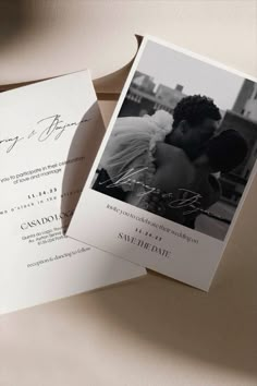 a wedding card with an image of a couple kissing on the forehead and in black and white