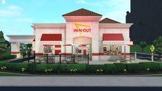 the front of a restaurant with red and white awnings