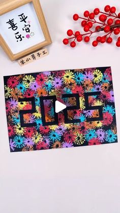 an image of colorful flowers on a white surface next to a clock and cherries