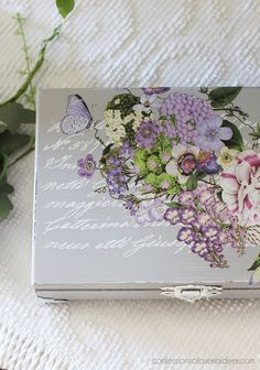 a box with flowers and butterflies on it