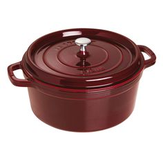 a red casserole dish with a lid on the top and bottom, sitting in front of a white background