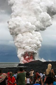 People watch from a viewing area as an explosion takes place on Kilauea, one of the world's most active volcanoes, in Pahoa, Hawaii. Legend says the volcano goddess Pele dug fire pits as she traveled from island to island looking for a home with her brothers and sisters. She finally settled at Kilauea's summit, where she lives at Halemaumau crater. Pahoa Hawaii, Big Island Of Hawaii, Kona Hawaii, Island Of Hawaii, Aloha Hawaii, Big Island Hawaii, Hawaii Island