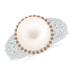 The coffee diamond halo enhances the allure of the Freshwater cultured pearl. Prong and bezel-set white diamonds embellish the split shank and lend their brilliance to the design. The intricate milgrain work and the filigree on the gallery elevate the exquisiteness of this ring in 14k white gold. Cultured Pearl Ring, Pearl Rings, Diamond Halo Ring, Split Shank, Halo Diamond Ring, Halo Ring, Halo Rings, Diamond Halo, The Coffee