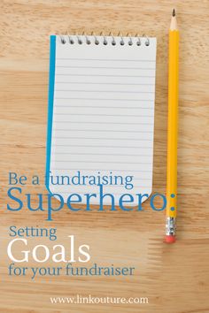 a notepad and pencil sitting on top of a wooden table with the words be a fundraiser superhero setting goals for your fundraiser