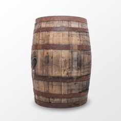 a wooden barrel sitting on top of a white surface