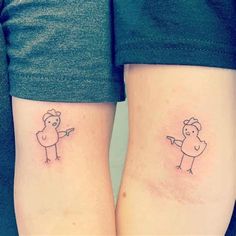 two people with matching tattoos on their legs