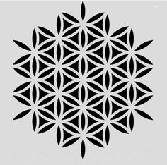 the flower of life symbol is shown in black on a gray background, and it appears to be cut out from paper