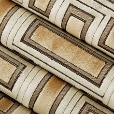 four pieces of brown and beige fabric with squares on them, all in different sizes