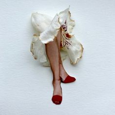 a woman's legs in red shoes and white fabric