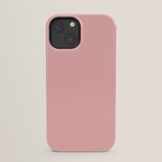 a pink iphone case sitting on top of a white surface