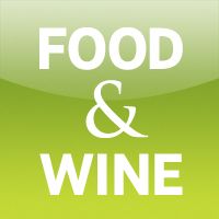 food and wine sign on a green background with white lettering that reads, food & wine