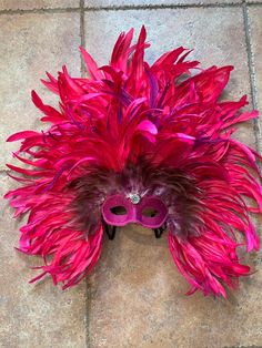 Gorgeous huge feathered mask of pink feathers with speciality feathers as accents. Ready for Mardi Gras, festivals, weddings.  Large feathered mask made by New Orleans premier maskmaker. Made by hand by local French Quarter artist for Mardi Gras parades, balls, masquerades, or your occasion. Our masks also come ready to display on your wall or mask stand.  Lightweight and comfortable. Beautiful jewel in center of forehead.  This beautiful one of a kind mask would look stunning on men or women for your event.  We do custom work and would love to talk to you about your wedding or birthday or masquerade. 20 years experience making masks for all sorts of special occasions. We can even make changes to the masks currently for sale. Message or call and ask, please. We want to make a mask you love Flamingo Mask, Feathered Mask, Mardi Gras New Orleans, Mardi Gras Parade, Pink Mask, Pink Feathers, French Quarter, S K, Beautiful One