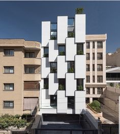 an apartment building with many windows and balconies