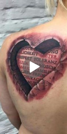 a woman with a heart tattoo on her back