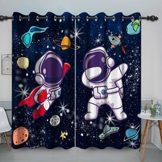 the curtains are decorated with an astronaut and planets theme