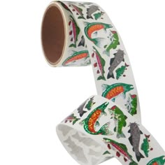 a roll of white tape with colorful dinosaurs on it