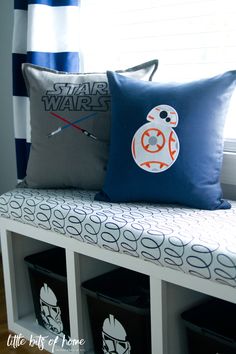 a star wars pillow sitting on top of a white bench