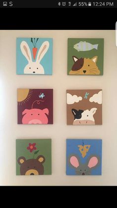 four square paintings with animals on them are hanging on the wall in front of a window