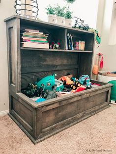 an old wooden toy chest with toys in it