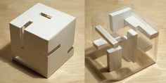 two cardboard boxes that have been cut into smaller shapes and placed on top of each other