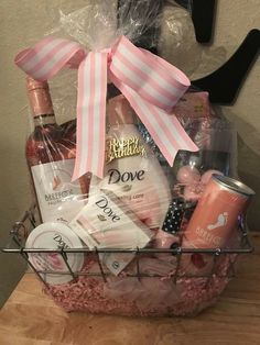 a basket filled with lots of goodies on top of a wooden table