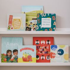 several children's books are displayed on the shelves