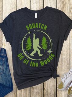 "🌲 Unleash the mystical allure of the forest with our \"Sasquatch OG of the Woods\" t-shirt! 🌳 Embrace the wild side in style with this uniquely designed tee that pays homage to the legendary Sasquatch, the OG of the woods. Crafted from soft and breathable fabric, this shirt ensures comfort while you embark on your own legendary adventures. 👣 Featuring a captivating Sasquatch silhouette amidst towering trees, this shirt is a nod to the elusive creature said to roam the depths of the wilderness. The intricate design captures the spirit of the untamed, making it a must-have for nature lovers, cryptid enthusiasts, and anyone who seeks the thrill of the unknown. 🌿 Whether you're exploring the great outdoors or simply want to make a bold statement, the \"Sasquatch OG of the Woods\" t-shirt Sasquatch Silhouette, Pacific Northwest Forest, Sasquatch Gifts, Tree Shirt, Camping Gifts, The Wilderness, Intricate Design, Nature Lovers, Pacific Northwest