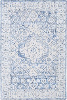 a blue and white rug with an intricate design