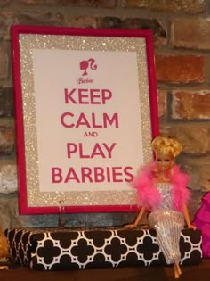 there is a barbie doll next to a sign that says keep calm and play barbies