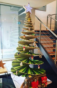 a christmas tree made out of stacks of books