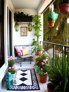 a balcony with potted plants on it and a black and white rug in the foreground