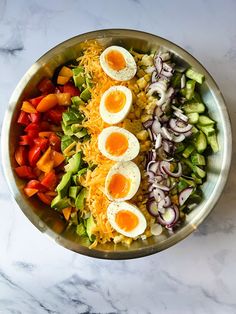 a salad with hard boiled eggs on top