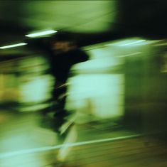 a blurry photo of a person riding a bike