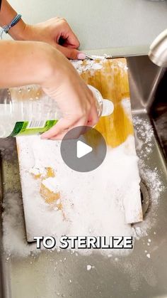 a person is washing food in a sink