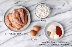 ingredients for chicken tenderies laid out on a marble counter