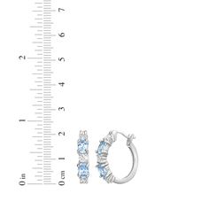 These petite hoop earrings bring just the right touch of sparkle to your day or evening look. Created in sterling silver, each earring features oval-cut Swiss blue topaz that alternate with round-cut white lab-created sapphires. These hoops secure with hinged backs. Blue And Silver Earrings, Sapphire Hoop Earrings, White Lab, Kay Jewelers, Swiss Blue Topaz, Topaz Stone, Sapphire Stone, White Earrings, Earrings Sterling Silver