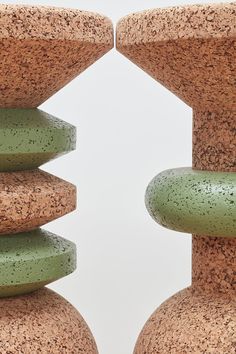 two green vases sitting next to each other