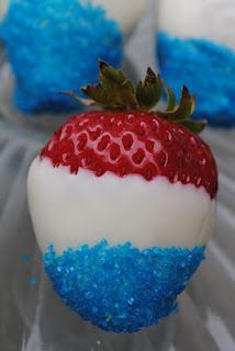 an image of a strawberry with green and white frosting on it's side