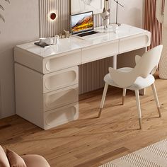 a white desk with a laptop on it and two chairs in front of the desk