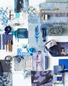 an assortment of blue and white items displayed on a wall